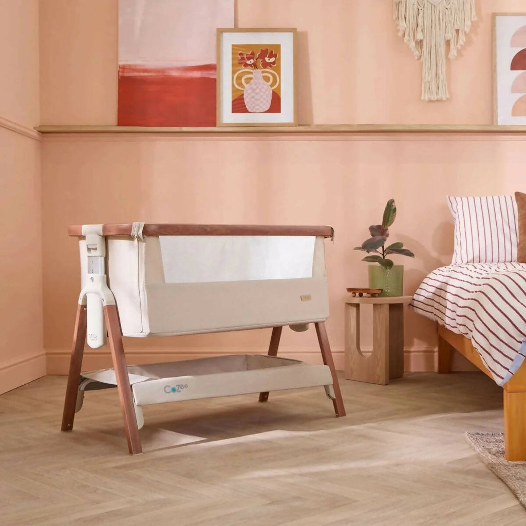 Bedside crib with ecru fabric panels and walnut-finish legs