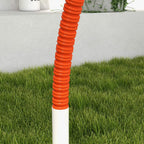 Orange stackable weave poles with white bases, close-up