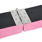 Pink balance beam folding hinge with metal bracket connecting foam sections.