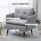 Grey upholstered armchair with button-tufted back cushion and well-padded seat