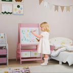 Pink kids art easel with whiteboard panel and front storage bins while a child draws