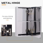 Mirror storage cabinet showing metal hinge mechanism and glass interior shelves