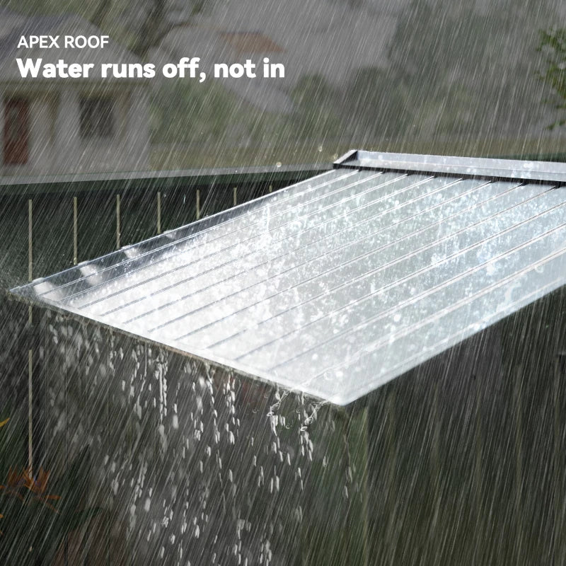 Light grey metal shed apex roof panel with rain water runoff over the roof surface.
