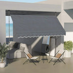 Dark grey manual retractable awning over outdoor seating with scalloped front