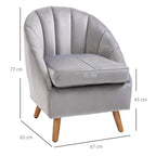 Grey velvet armchair with vertical channel tufting, rounded arms, and wooden legs