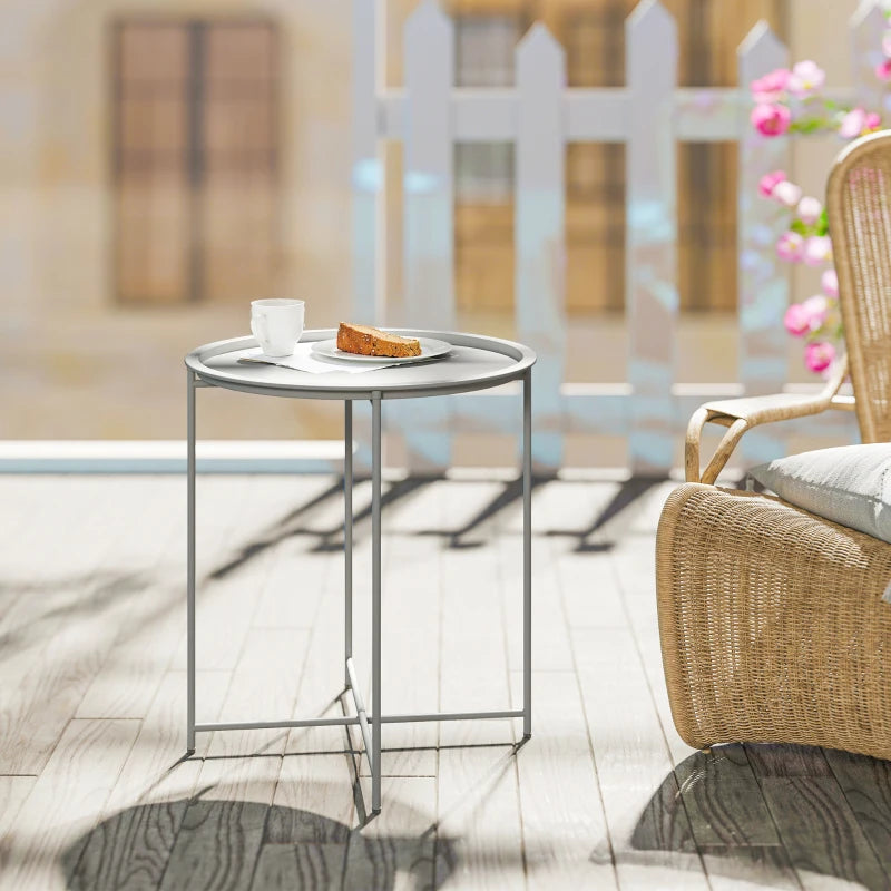 White round tray patio table with four metal legs and side frame base