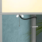 Light grey lamp column with upper socket, white bulbs, and hanging pull chain