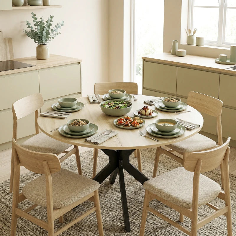 Natural wood round dining table with black base for shared meals