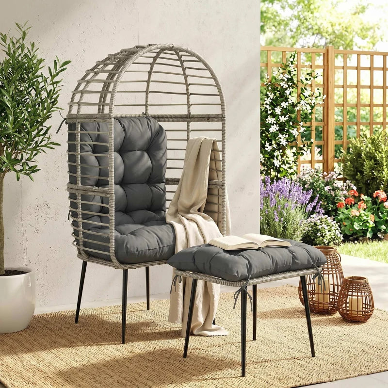 Light grey egg lounge chair with thick cushions and matching footstool on legs