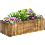 Wooden raised garden bed planter box with flowering herbs and plants