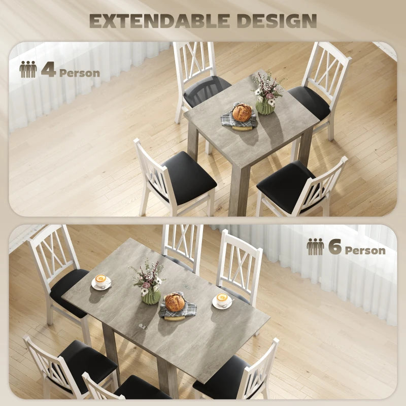 Grey extendable dining table set with black chairs for 4 to 6 people.