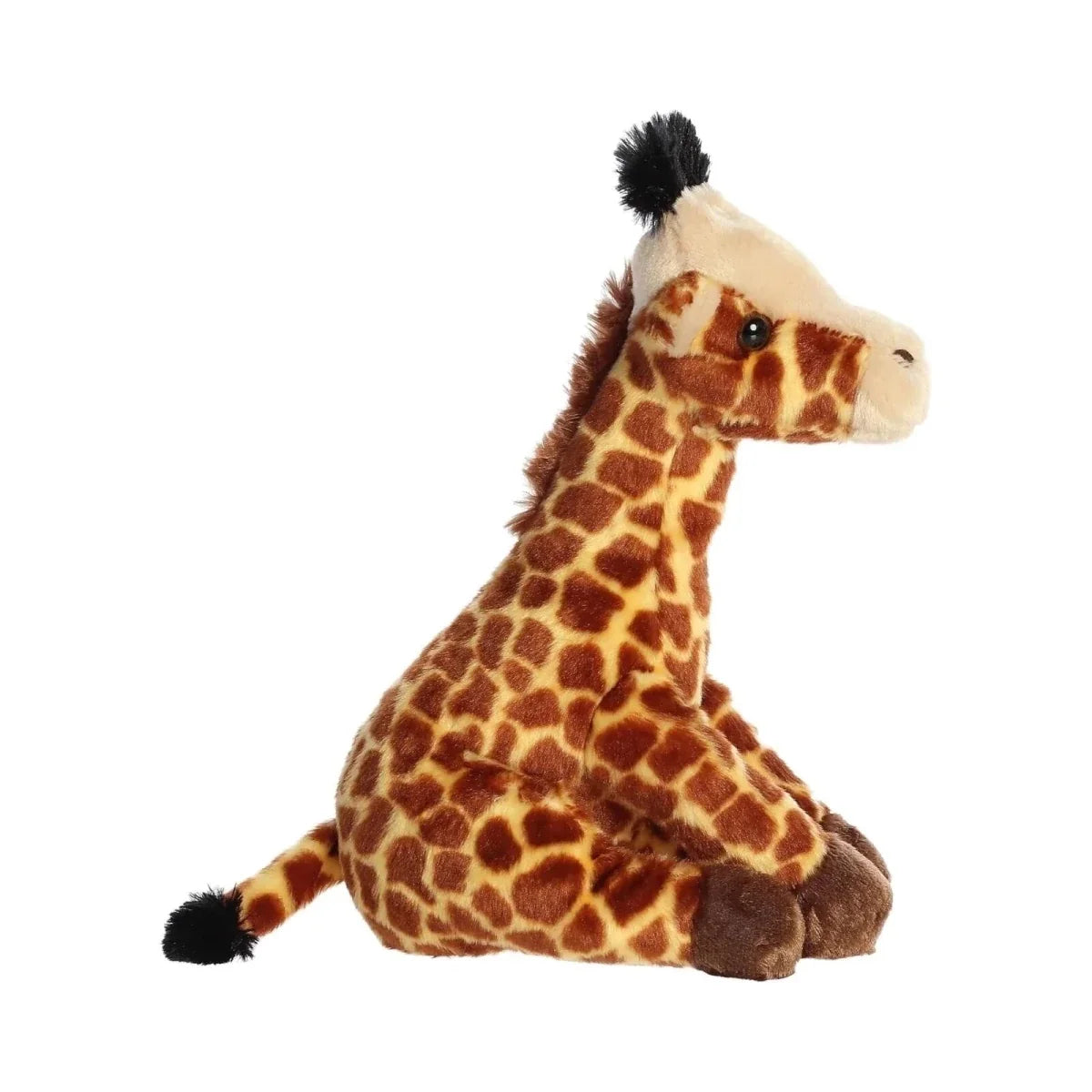 Giraffe plush toy sitting with brown spotted pattern, white muzzle, and black tail tuft