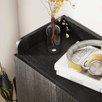 Black shoe cabinet top shelf with textured finish, showing stored items and shoes