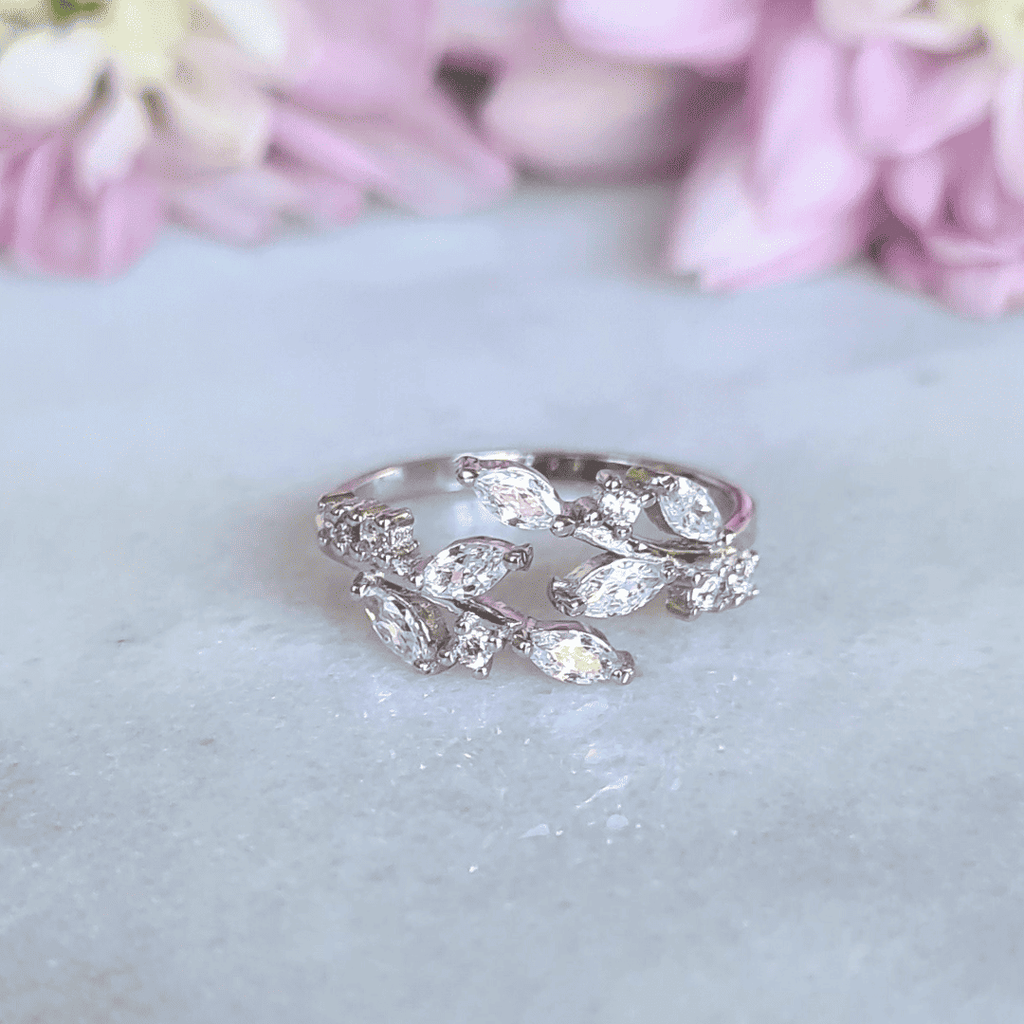 Adjustable sterling silver leaf ring with marquise-cut stones in open band