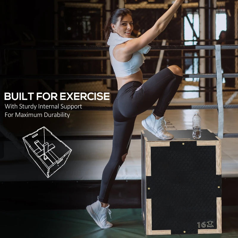 Black wooden step-up jump box for home workouts, shown mid-step