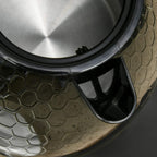 Black kettle spout filter area with mesh strainer detail and shiny inner rim close-up