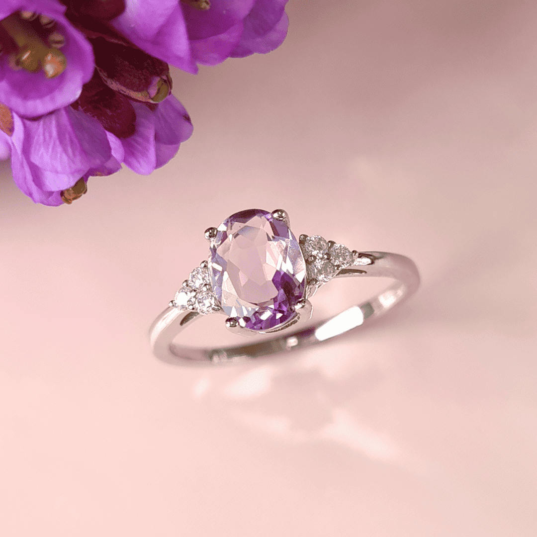 Sterling silver amethyst ring with oval lavender gemstone and diamond halo accents