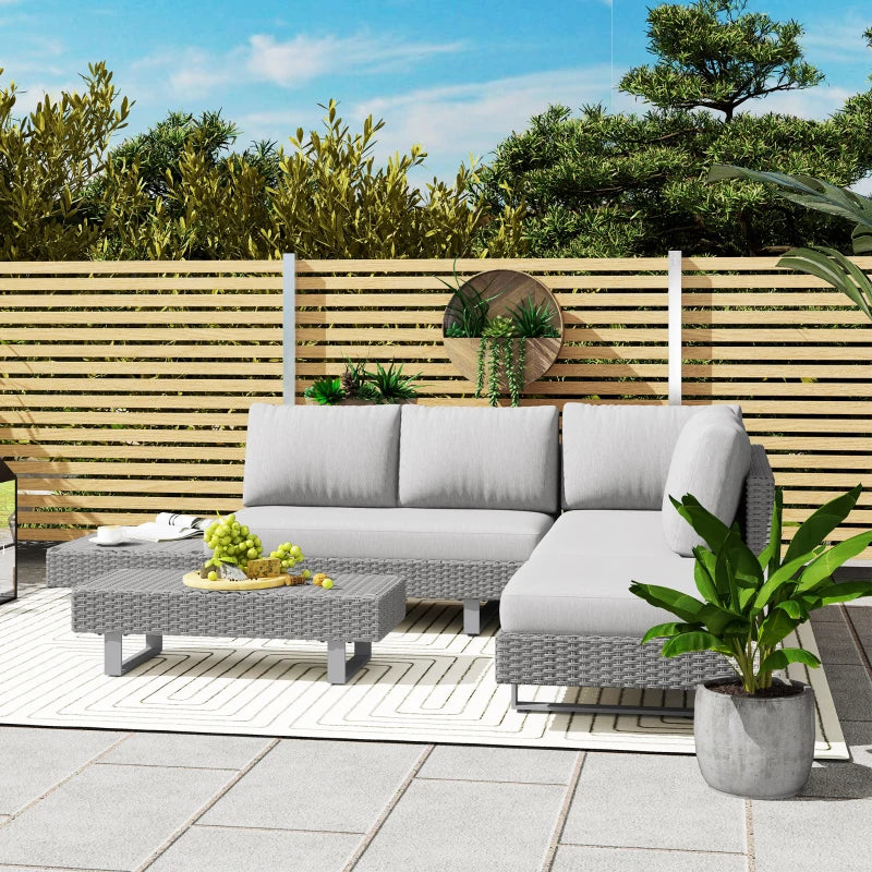Light grey rattan corner sofa set with cushions and woven coffee table