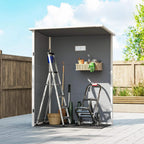 Open grey storage shed with window and organized tools inside