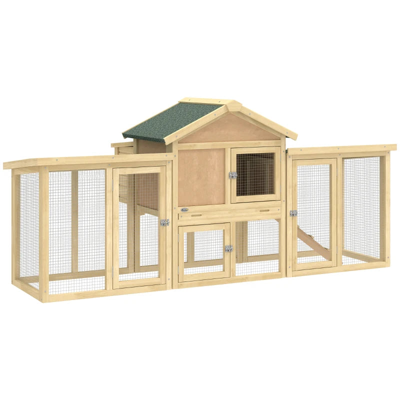 Large wooden chicken coop with green roof, wire mesh sides, front doors, and ramp