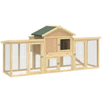 Large wooden chicken coop with green roof, wire mesh sides, front doors, and ramp