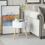 White round bedside table with drawer and light wood legs