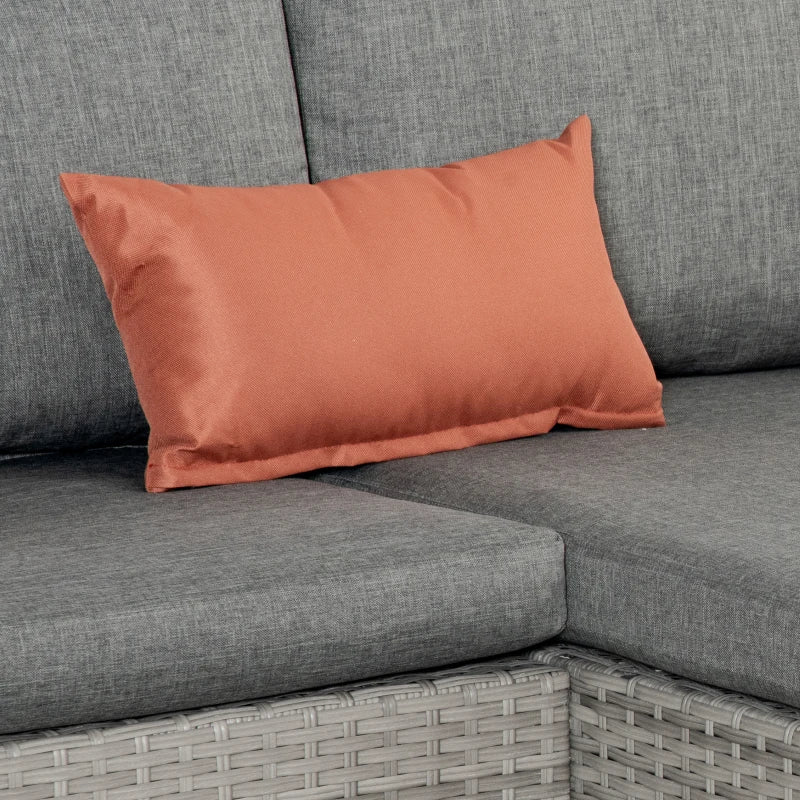 Orange throw pillow on grey outdoor sofa with thick seat cushion
