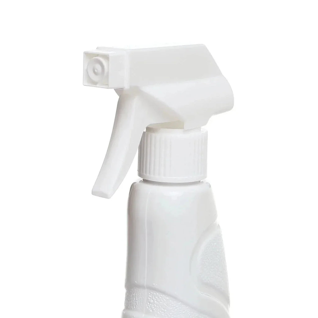 Spray trigger and cap on white baby stain remover bottle