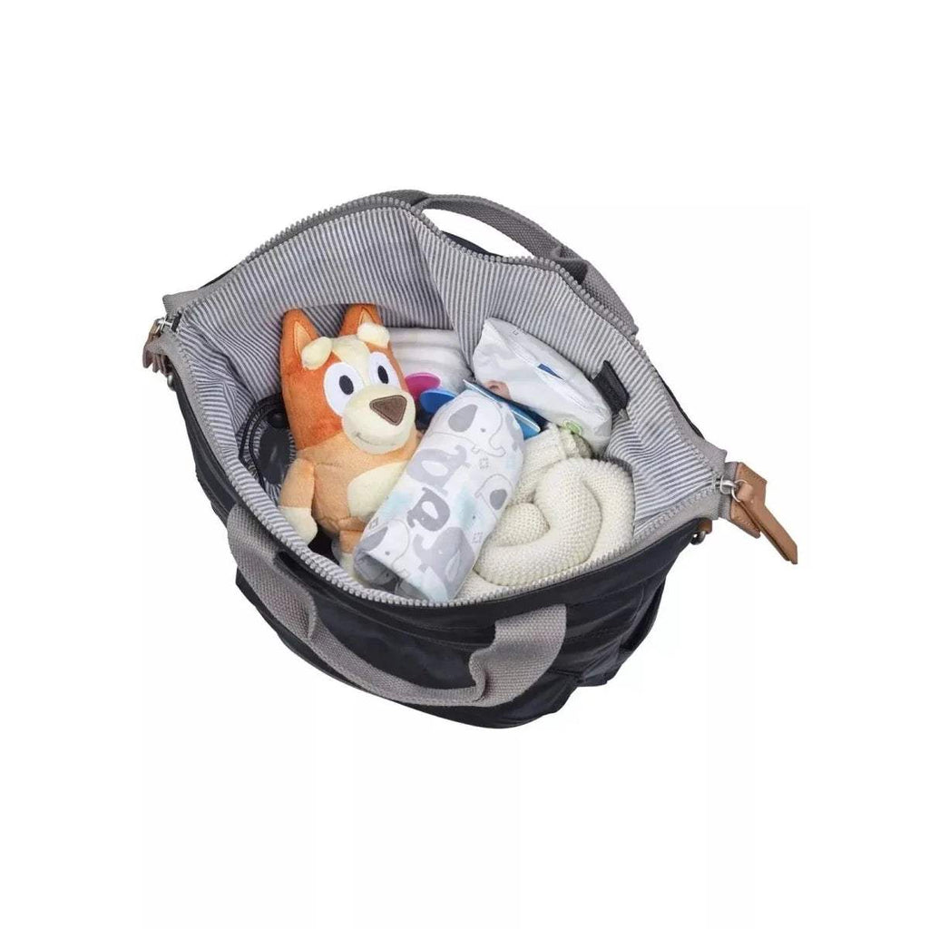 Black and gray changing backpack with open top and cushioned interior holding baby items