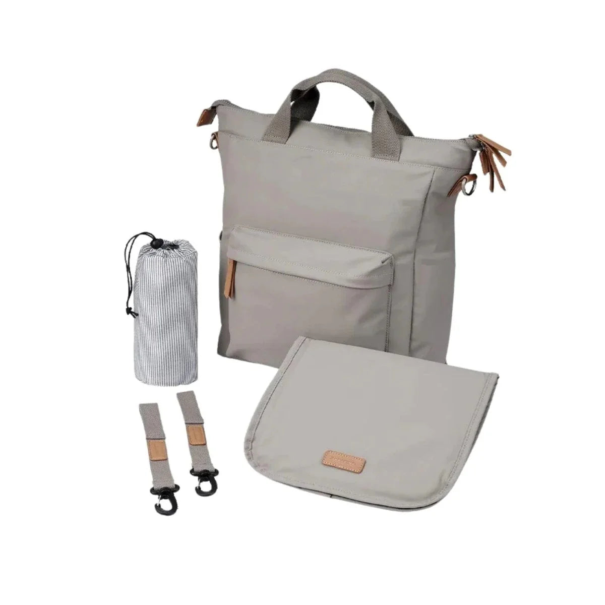 Beige changing bag with front pocket, top handles, and crossbody strap