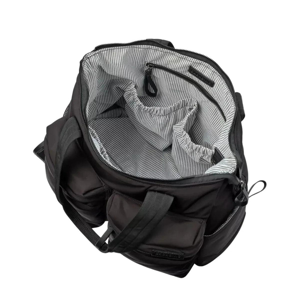 Black changing bag interior view with striped lining and zip pockets