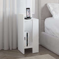 White narrow bedside table module with open shelf and phone dock on top