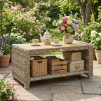 Light brown PE rattan coffee table with slatted top and open storage shelf for items