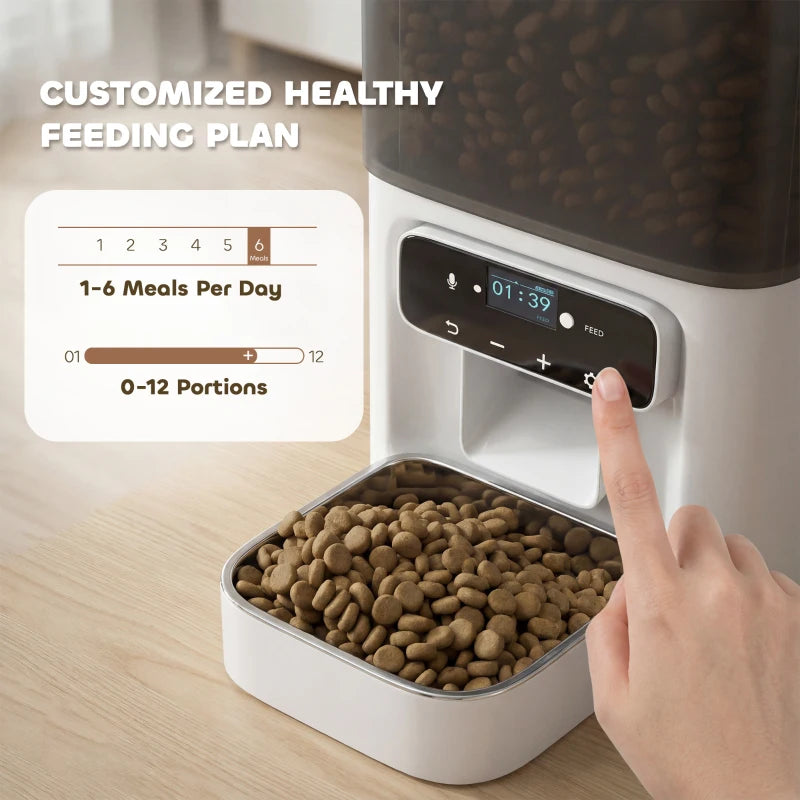 White cat feeder with open food compartment and finger tapping the timer controls