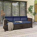 Outdoor 3-seater rattan sofa with dark blue cushions and woven side arm panels