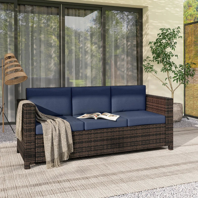 Outdoor 3-seater rattan sofa with dark blue cushions and woven side arm panels