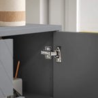 Grey sideboard cabinet door hinge and latch hardware over an empty interior