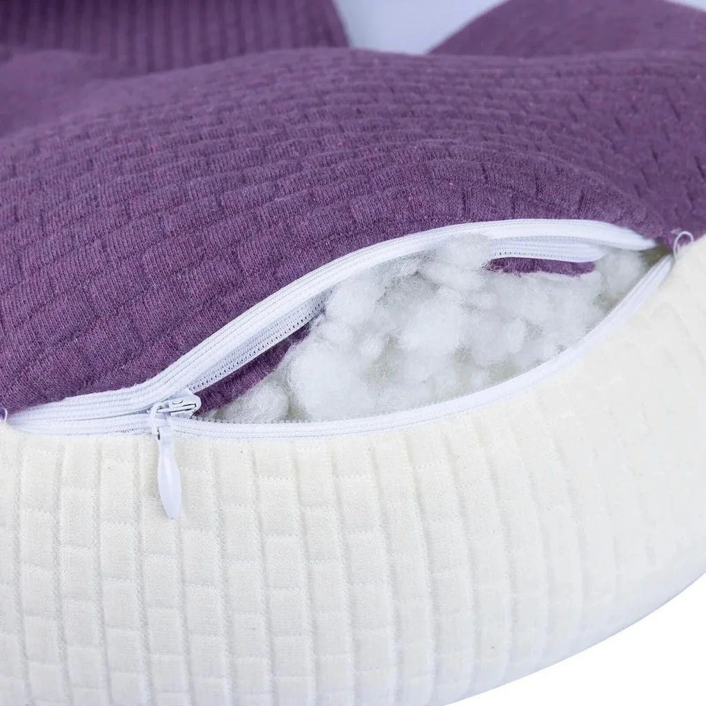 Purple maternity support pillow with white zipper pocket showing inner filling