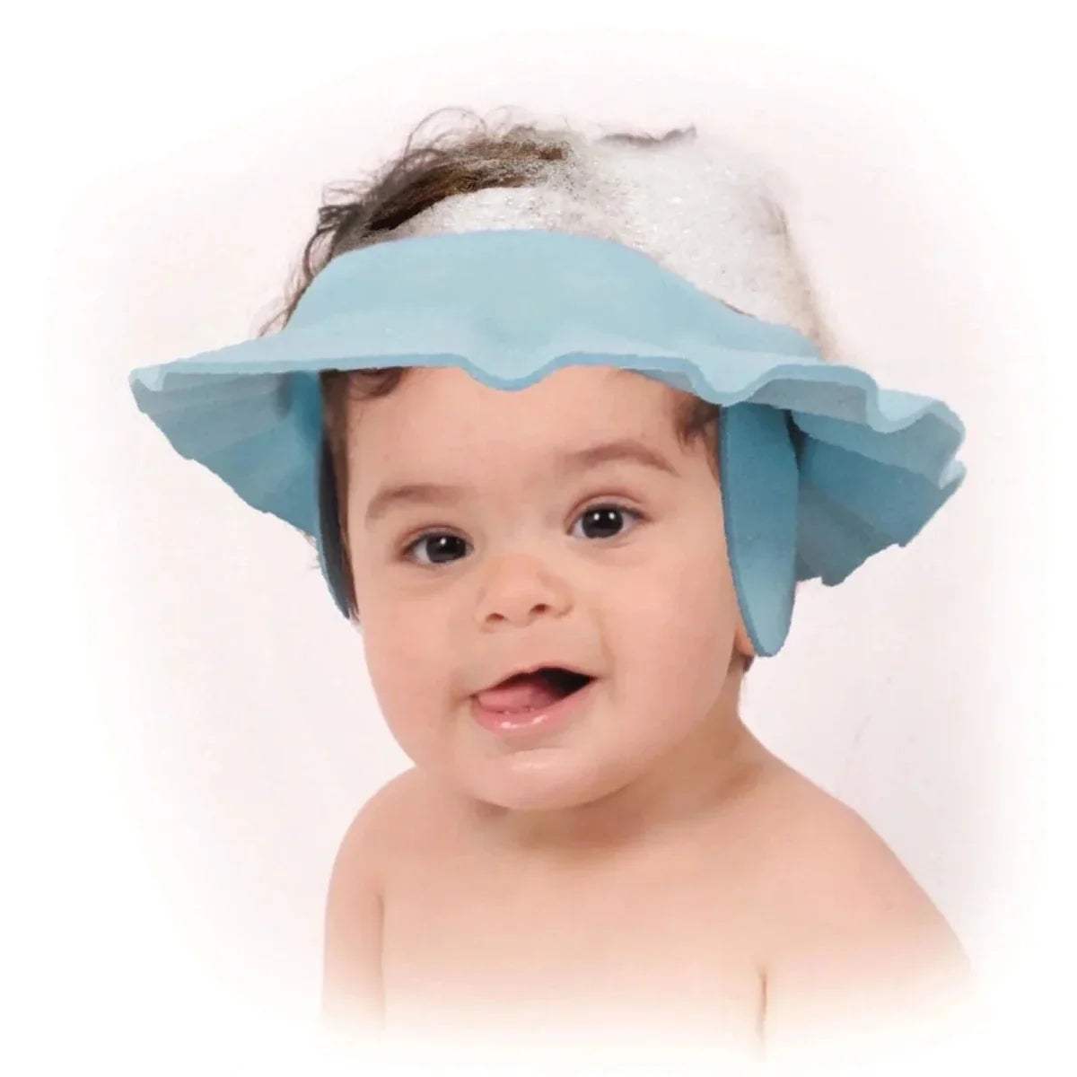 Light blue bath cap on baby’s head with wide brim and adjustable tabs