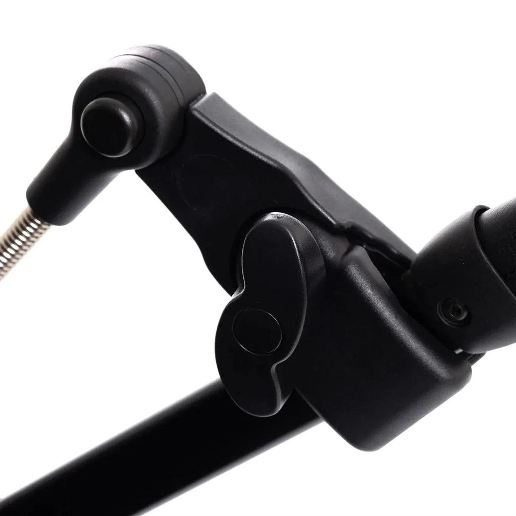 Black stroller frame joint with parasol arm attachment and metal spring