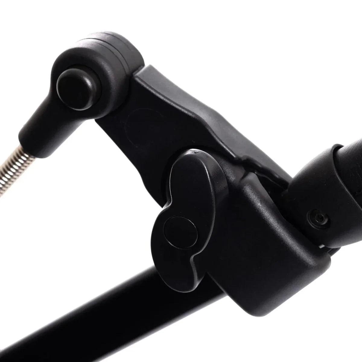 Black stroller frame joint with parasol arm attachment and metal spring