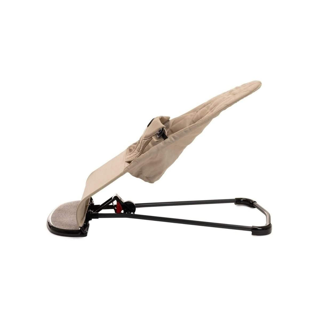 Beige baby bouncer rocking stand with fabric canopy and black metal base