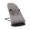 Grey fabric baby bouncer with quilted seat and arched rocker base