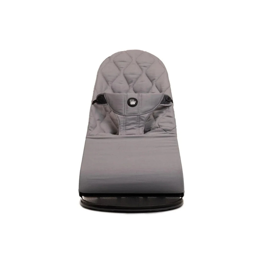 Grey fabric baby bouncer with quilted backrest and curved stability base