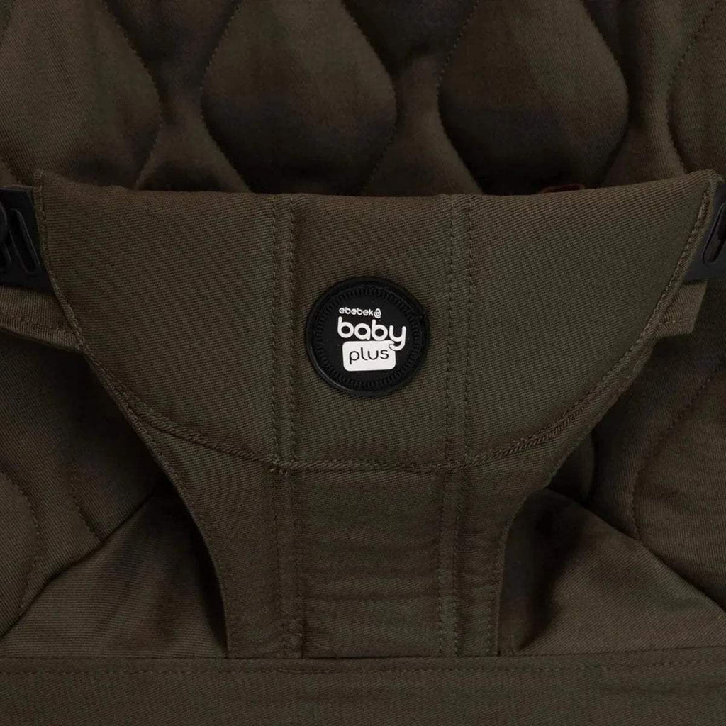Khaki baby bouncer seat cover with “baby plus” logo patch and stitched harness.