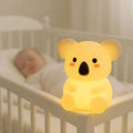 Koala-shaped silicone night light, warm yellow glowing bear design