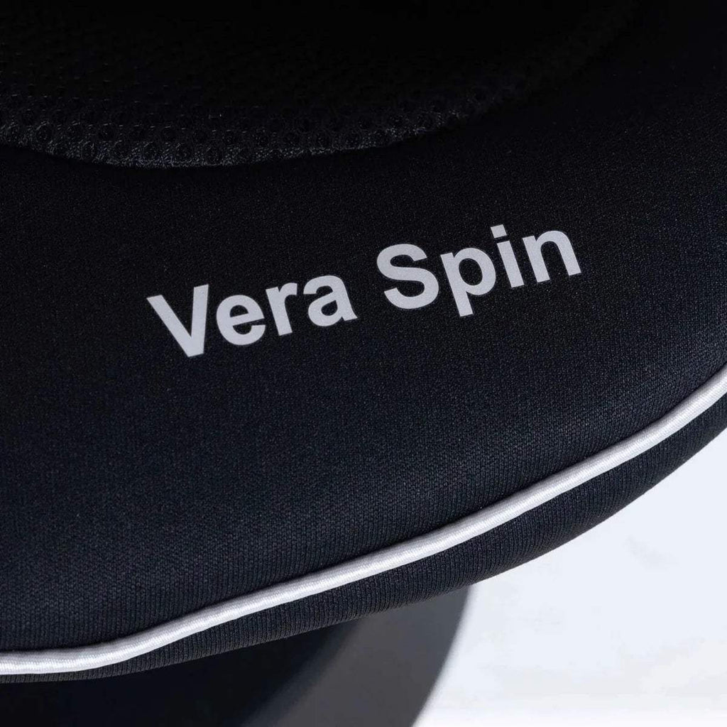 Black headrest with “Vera Spin” printed text and curved silver trim
