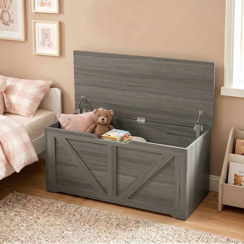Dark grey wood-effect storage box with open lid and safety hinges, stuffed toy inside