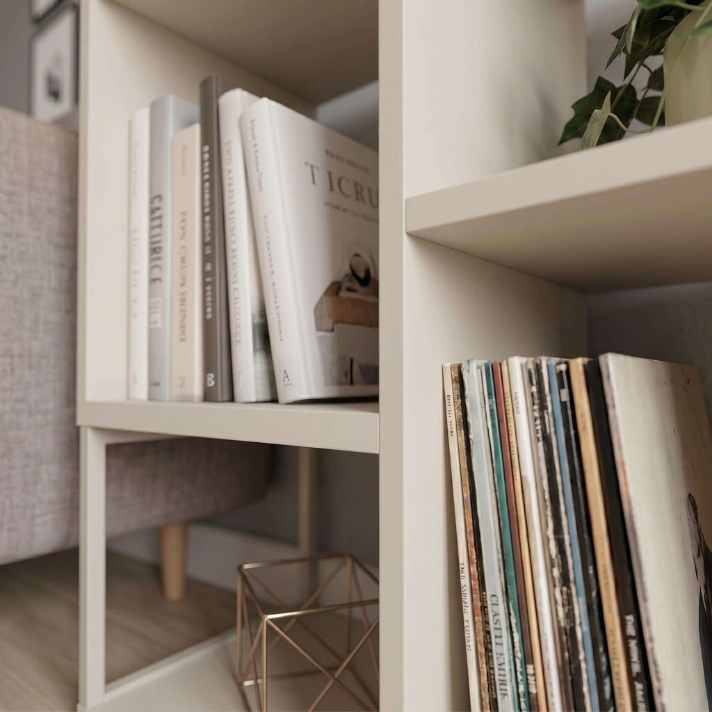Close-up of light interior shelves in a mini bookcase side table with books