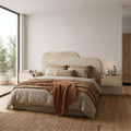 Curved stone-look king-size wall headboard, light sandstone/beige with rounded top